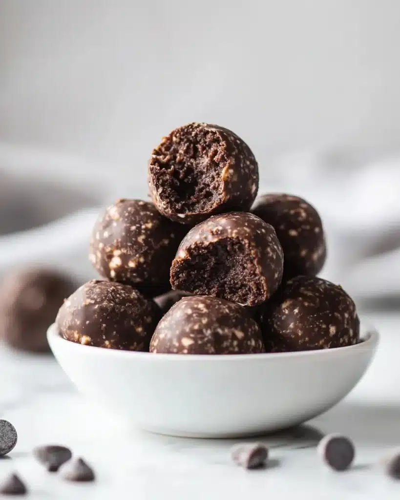 No-bake cottage cheese brownie bites in a bowl, healthy protein snack
